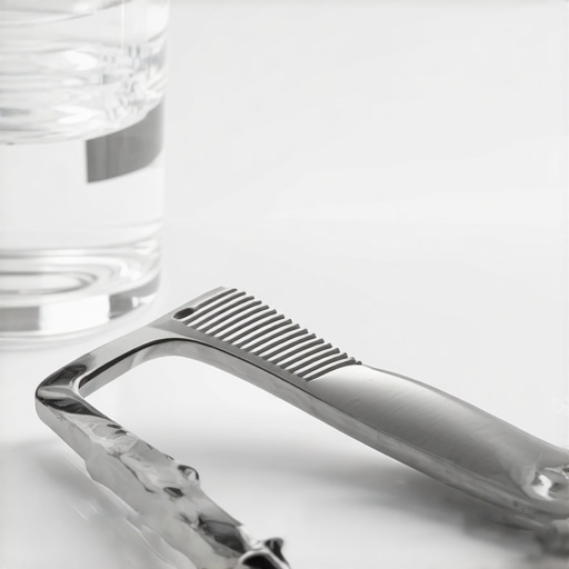 A tongue scraper and water glass for oral hygiene on a keto diet