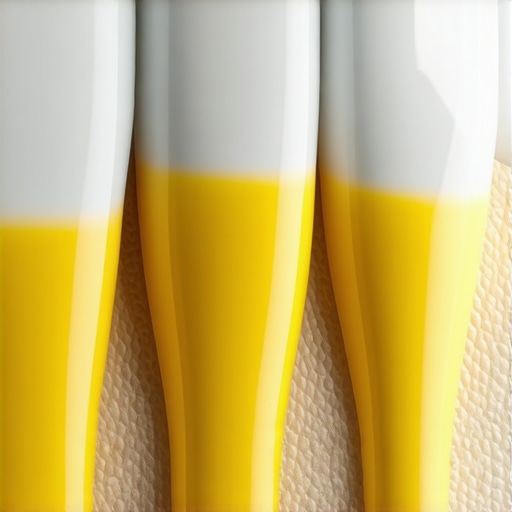 Close-up showing yellow dentin exposed by hard brushing at the gum line.